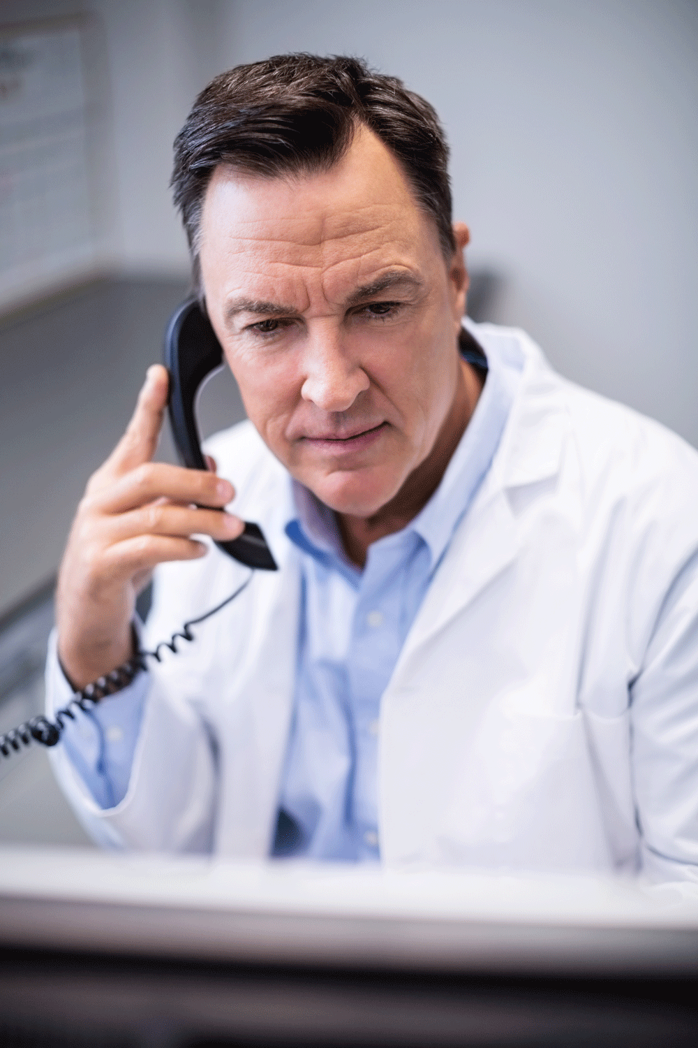 male doctor on the phone